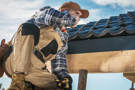 Akraba Construction roof contractor talking on cell phone 8WQRQMF