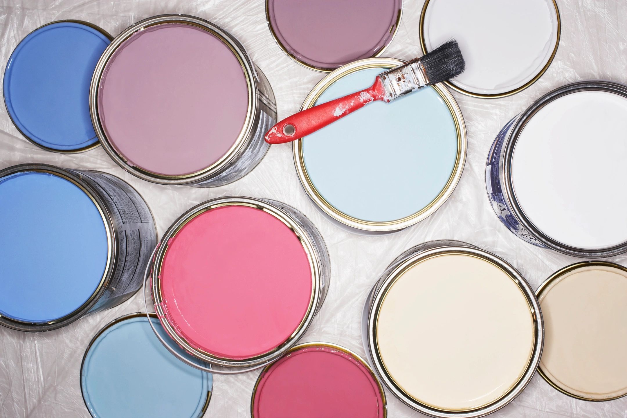 A row of multiple colorful paint swatches on paper strips showcases a vibrant spectrum of shades to help homeowners select the right paint colors for their interior design projects.