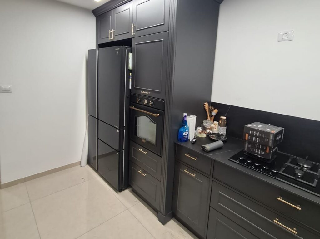 Kitchen remodel with charcoal shaker cabinets and a built in oven tower by Akraba Construction LLC, serving Frisco, TX