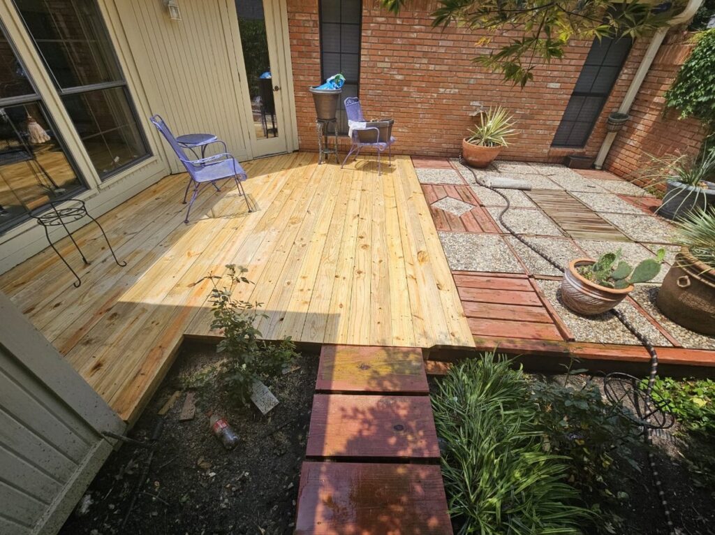 New pine wood deck beside a brick patio by Akraba Construction LLC, serving Addison, TX